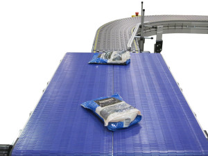 two 2200 Modular Belt conveyors moving at different speeds moving pouches