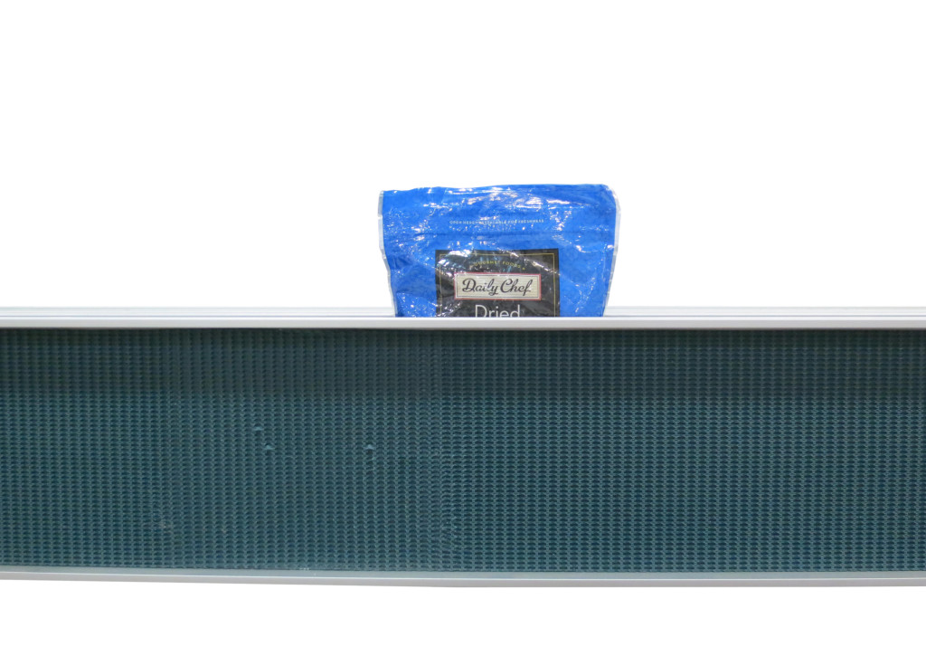 two 2200 Modular Belt conveyors moving at different speeds orienting pouch