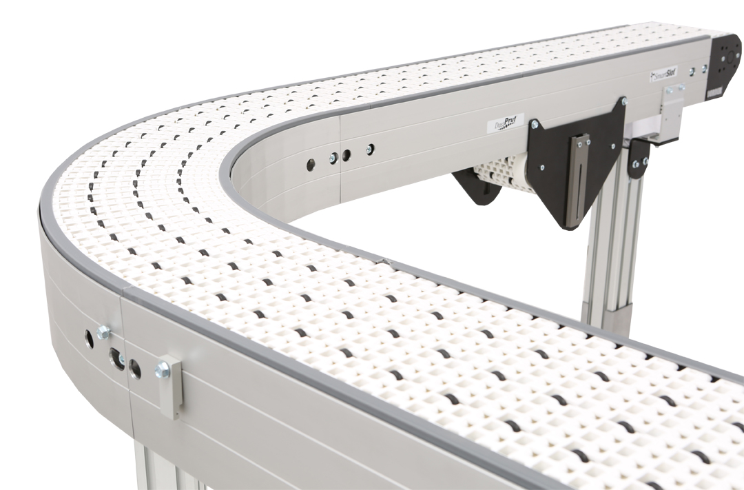 Curved conveyor with roller top belt