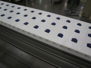 , How Roller Top Belts Keep Packages Safe