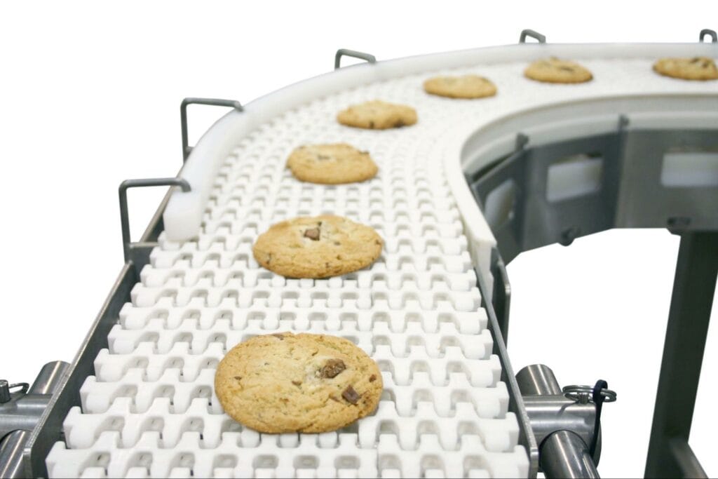 A Dorner AquaPruf 7400 sanitary conveyor transports cookies.