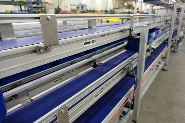 The side of a Dorner conveyor for material handling. 