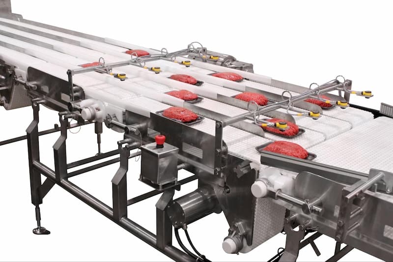 A sanitary conveyor from Dorner safely processes raw hamburger meat. 