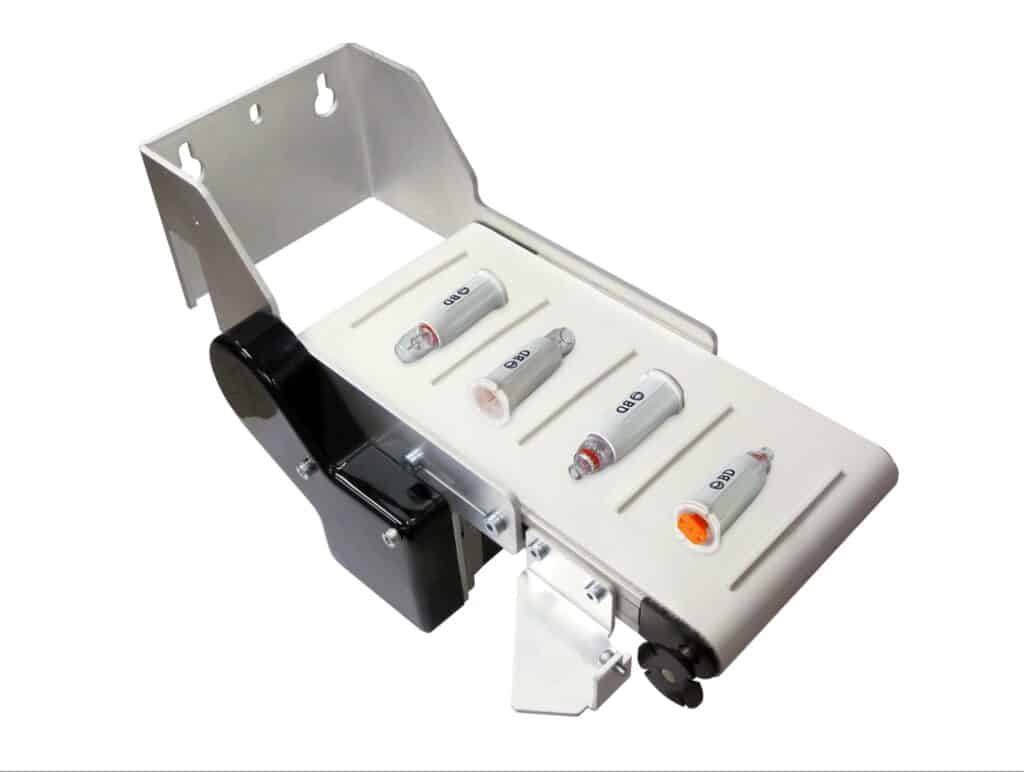 An 1100 Series miniature conveyor from Dorner transporting medical supplies.